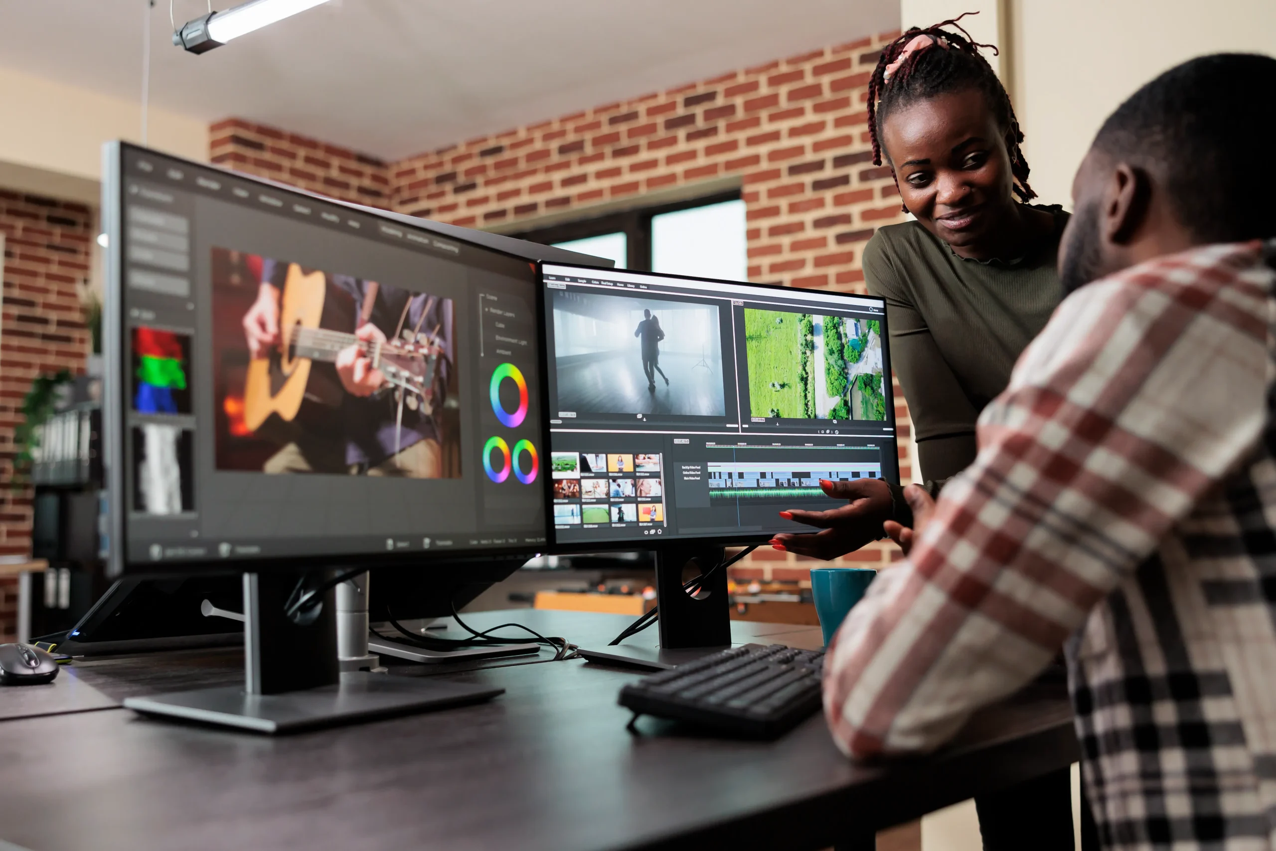 post-production-department-leader-advising-colleague-improve-colors-frames-quality-footage-creative-professional-video-editors-collaborating-order-finish-film-project-upon-deadline-scaled