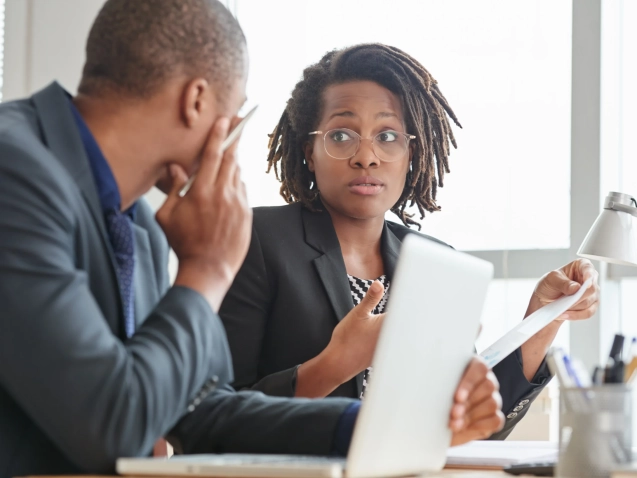 afro-american-male-female-colleagues-suits-talking-office